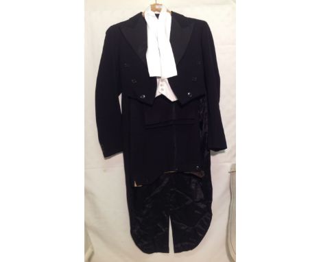 A 1930's tailcoat jacket and trousers, with a vintage, white, tailored waist coat. (3) 