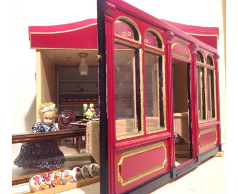 Dolls House item called The Plate Rack includes doll and furniture. 