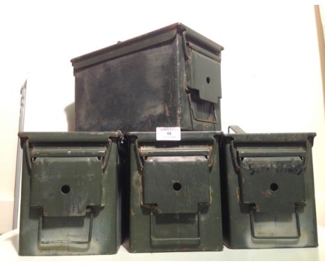 Four army ammunition tins.