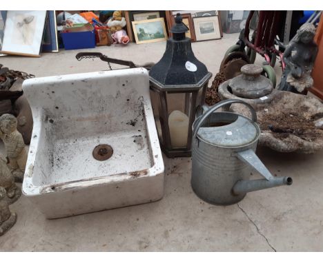 A WHITE BELFAST SINK, A GALVANISED WATERING CAN AND A CANDLE LANTERN 