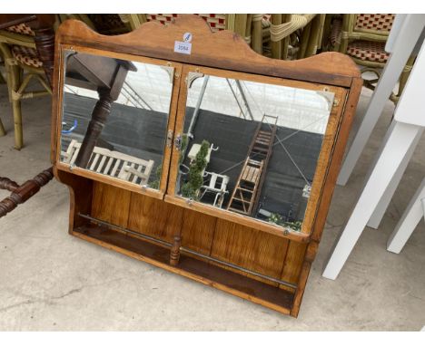 A VINTAGE OAK EFFECT MIRRORED TWIN DOOR UNIT 