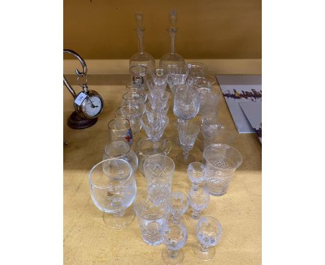 A LARGE QUANTITY OF GLASSWARE TO INCLUDE CUT GLASS - ETCHED DECANTERS, DESSERT BOWLS, LICQUER GLASSES, WINE, BRANDY, ETC 