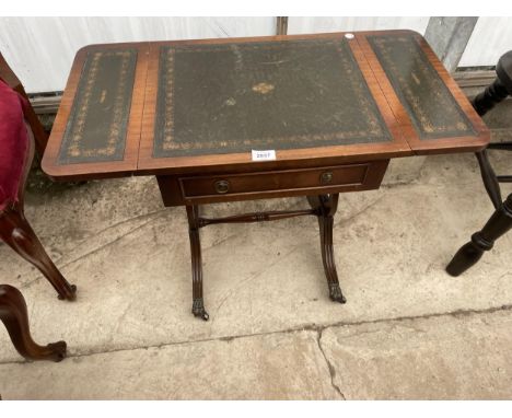 A REPRODUCTION MAHOGANY MINIATURE SOFA TABLE WITH INSET LEATHER TOP 