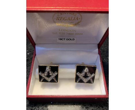 A PAIR OF 18 CARAT YELLOW GOLD FRONTED WITH 18 CARAT WHITE GOLD CUFF LINKS EACH DECORATED WITH A DIAMOND ENCRUSTED MASONIC EM