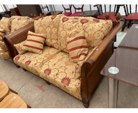 A 'MULTIYORK' HARDWOOD KNOLE DROP-SIDED SOFA WITH BERGERE ENDS, ON TURNED FRONT LEGS 