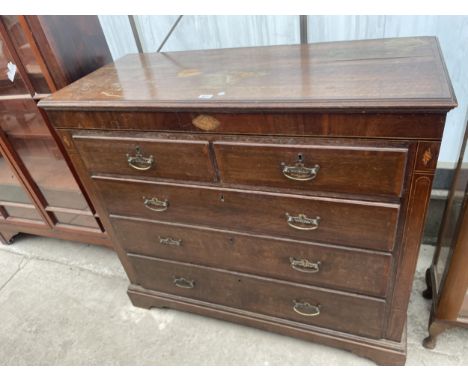 A GEORGE III OAK AND CROSSBANDED SHELL INLAID CHEST OF TWO SHORT AND THREE LONG DRAWERS, ON BRACKET FEET, 48" WIDE 