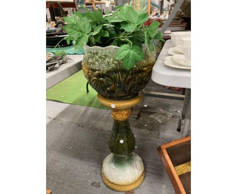 A LARGE CERAMIC JARDINERE AND PLANT 