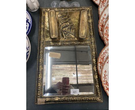 A VINTAGE BRASS FRAMED MIRROR WITH GALLEON TOP AND TWO BRUSHES 