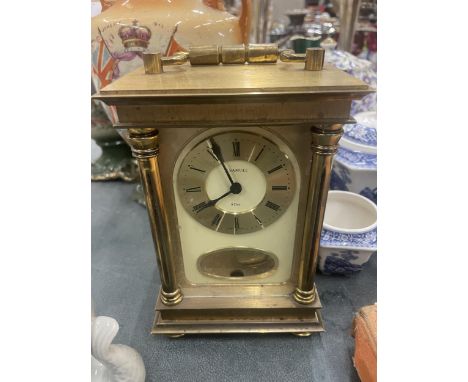 AN EIGHT DAY BRASS CARRIAGE CLOCK 