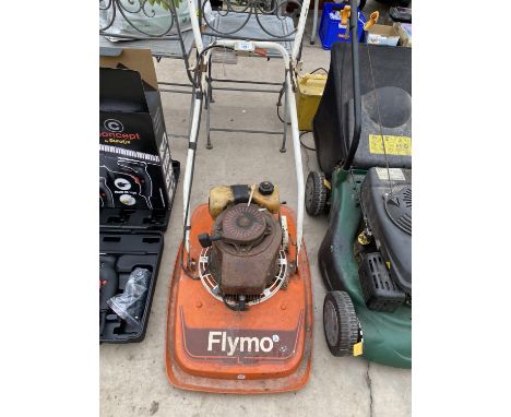 A VINTAGE FLYMO LAWNMOWER WITH PETROL ENGINE 