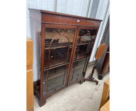 A 19TH CENTURY MAHOGANY AND INLAID TWO DOOR GLAZED BOOKCASE ON BRACKET FEET, 43.5" WIDE 