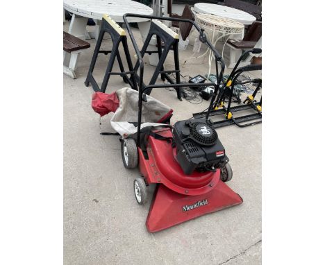 A MOUNTFIELD PETROL LEAF SWEEPER WITH 4 HP BRIGGS AND STRATTON ENGINE 