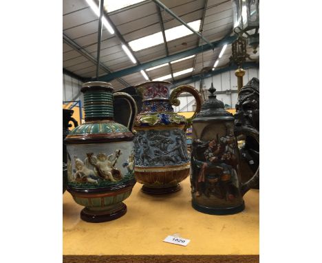 THREE LARGE CERAMIC ITEMS TO INCLUDE A MAJOLICA STYLE JUG AND A STEIN STYLE JUG 