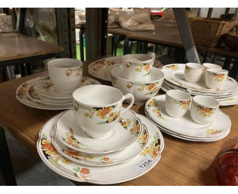 A QUANTITY OF VINTAGE JOHNSON BROS 'FLORIDA' PATTERN TEAWARE TO INCLUDE PLATES, CUPS, SAUCERS, EGG CUPS, A SUGAR BASIN, CREAM