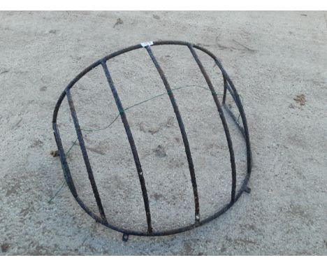 A WROUGHT IRON HAYRACK PLANTER 