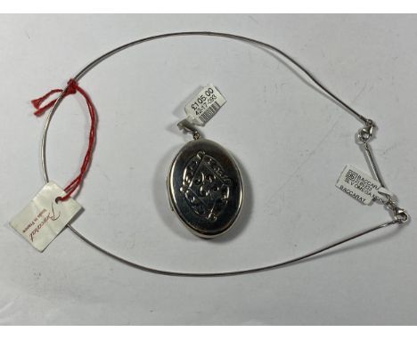 A CELTIC STYLE SILVER LOCKET PENDANT AND FURTHER NECKLACE 