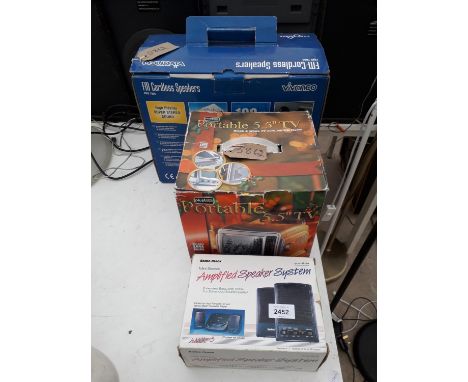 A PORTABLE TELEVISION, A CORDLESS SPEAKER AND AN AMPLIFIED SPEAKER SYSTEM 