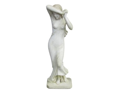 A weathered carved white marble figure nude, a young maiden carved in the round, in simple drapery, her hands held aloft, uns