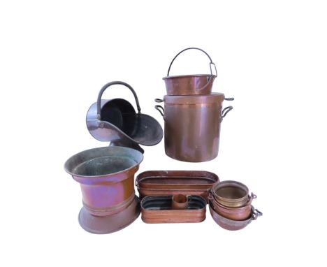 A selection of 19th and 20th century copper and brass coal scuttles, cooking pots, pans, jardiniere.