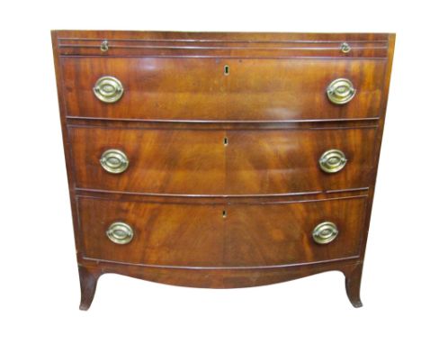 19th century bow front chest enclosed by three graduated drawers and a brush slide, the caddy top cross banded, 86cm high x 9