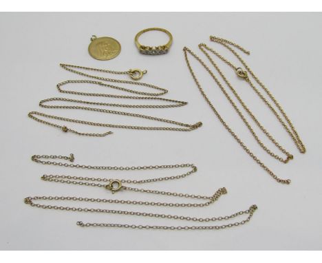 Group of gold jewellery comprising an 18ct illusion set diamond ring, 1.8g, a Madonna pendant / charm and three chain necklac