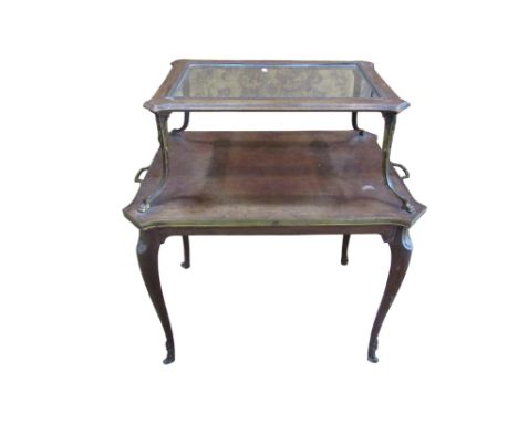 A French Empire style two tier mahogany etegere with glass top raised on cast supports over twin carrying handles raised on t