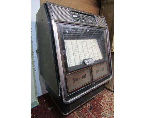 A vintage 20th century Rowe AMI 200 Selection Stereo Jukebox, 156cm high x 103cm x 72cm, together with associated records