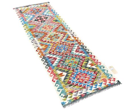 A Chobi kilim runner with interlocking stepped medallions 200cm x 65cm approximately 