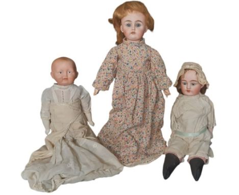 Three antique bisque head dolls comprising an 'Alma' shoulder head doll with closing blue eyes, open mouth with teeth and clo