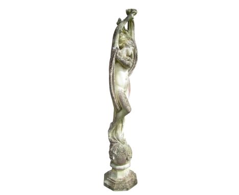 A large weathered cast composition stone garden ornament, in the form of a female nude with drapery in acrobatic pose raised 