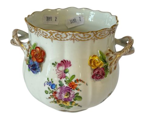 A Dresden lobed vase with painted floral bouquets and further applied detail 