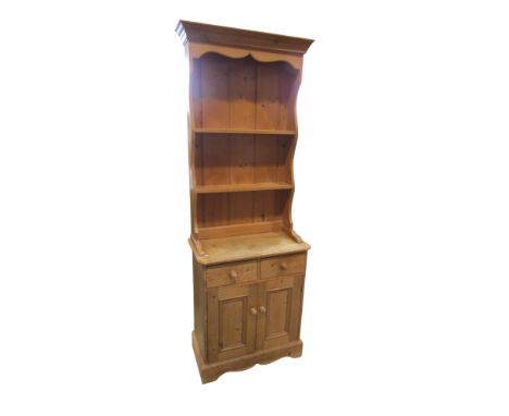 A diminutive pine dresser with enclosed back, twin drawers and cupboard doors, 188cm high x 66cm x 36cm