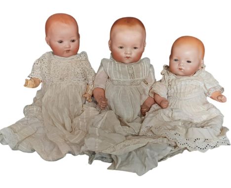 Three small 1920-30's German bisque head 'Dream Baby' dolls by Armand Marseille comprising mould 241 with closing brown eyes 