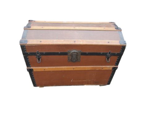 A Domed trunk with canvas finish and steel bands 
