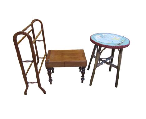 A Victorian mahogany bidet raised on turned supports (lacks liner), a simple towel rail, circular topped bound work and cane 