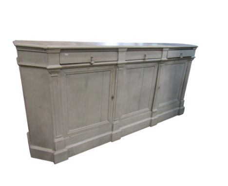 A large continental painted pine breakfront sideboard in the Gustavian style fitted with three frieze drawers over panelled c