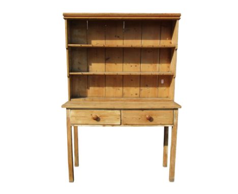 A 19th century stripped pine cottage dresser with raised open plate rack over two frieze drawers and square cut supports, 191