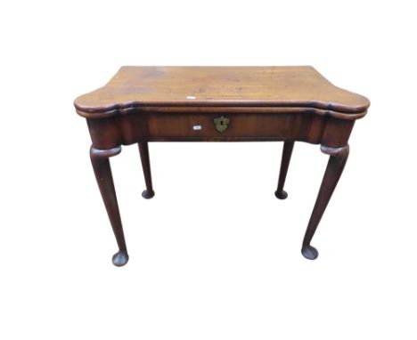 A mid-Georgian period mahogany fold over top card table with turret corners and gateleg action on pad feet, 73cm high x 90cm 