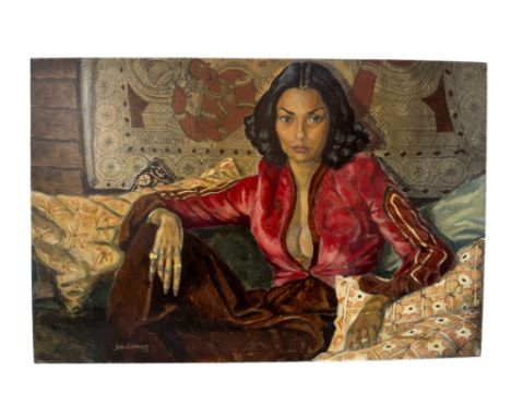 Peter Collinson (20th Century) - Portrait of a lady wearing a red shirt, seated on a sofa with decoratively patterned textile
