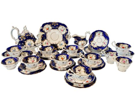 A 19th century Rockingham style tea service, each piece with hand painted floral bouquets within gilt borders