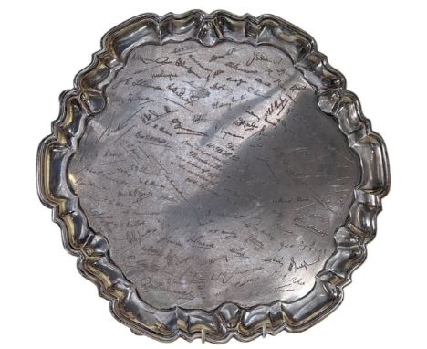 A large English silver presentation pie-crust salver with facsimile signatures and central script 'To Mr B. H. Binder from hi