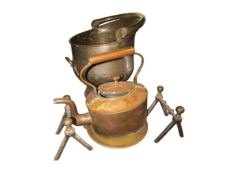 A planished copper helmet shaped coal scuttle together with an Arts &amp; Crafts style circular wall mirror, a pair of fire d