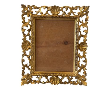 A 19th century Italianate gilt picture frame with carved decoration, glazed, 25.5 x 30.5 cm