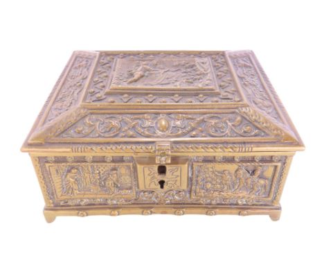An Italian brass casket with all over engraved decoration of medieval court scenes and circling serpents and grotesque masks,