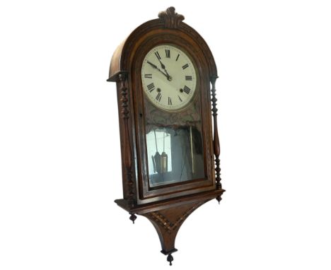 A late Victorian inlaid walnut wall clock of domed form, with 8” dial below carved fleur de lys, 86 x 36cm (maximum)
