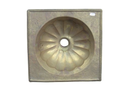 A decorative Moroccan brass sink, with scrolling engraved detail and fluted bowl, 37 x 37cm