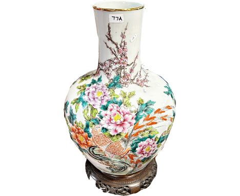 A large 20th century Chinese famille rose tianqiuping vase bearing six character Qianlong mark underneath in iron-red, standi