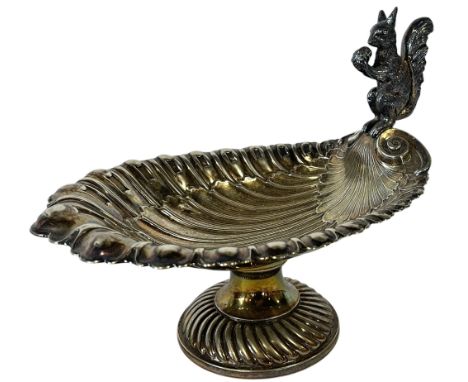 An early 20th century German WMF shell shaped nut bowl with a squirrel handle, on a circular spread foot, 28cm wide x 21.5cm 