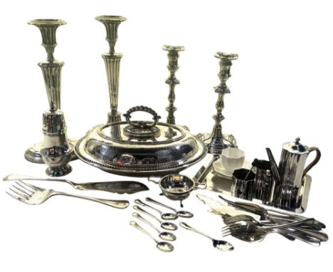 A pair of Matthew Boulton silver plated candlesticks with his double sunburst hallmark to the the base, together with another