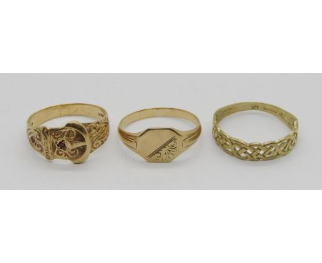Three vintage 9ct rings comprising a 1970s garnet set buckle ring, a 1950s signet ring and a Celtic design band ring, 5.3g to